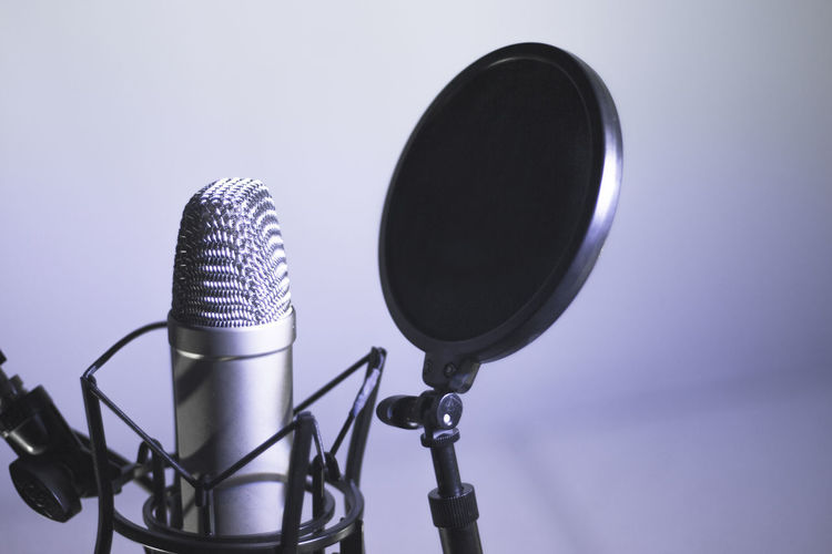 Close-up of microphone against white background
