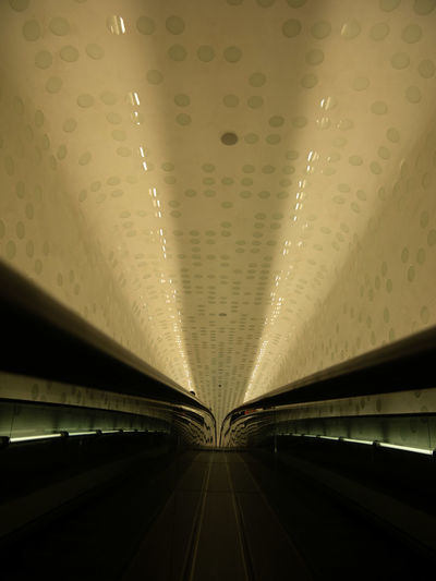 Low angle view of illuminated tunnel