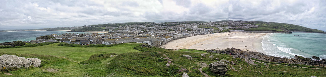 Panoramic view of st ives against cloudy sky