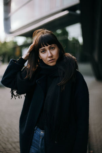 Portrait of a beautiful young woman on the street 