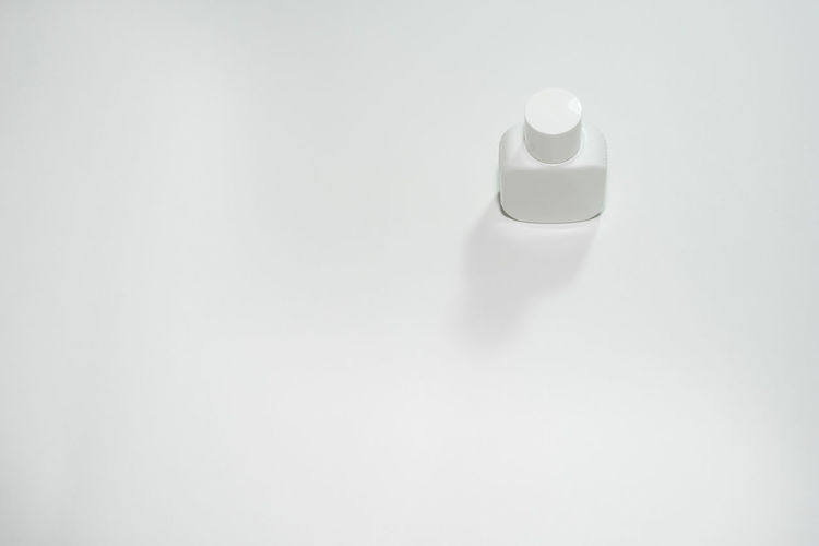 Close-up of bottle against white background