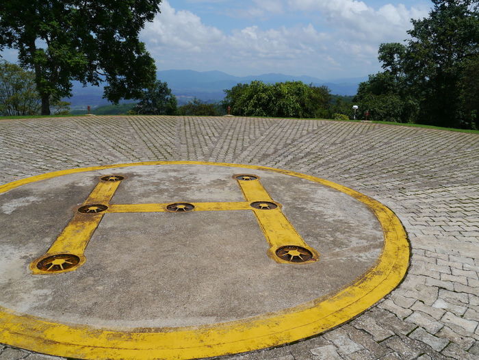 Helipad with trees in background