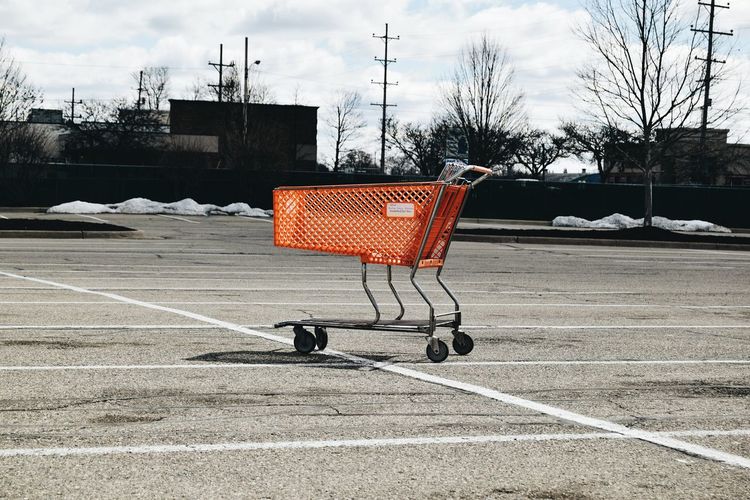 Abandoned shopping cart at parking lot