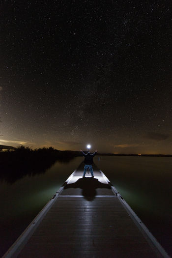 Person against clear sky at night