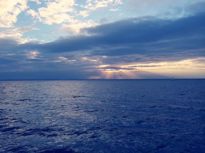 Scenic view of seascape against cloudy sky