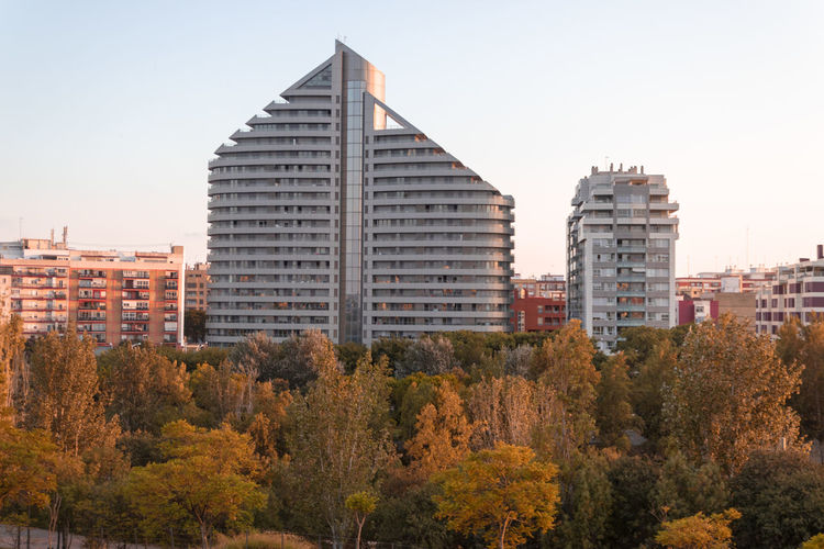 Modern buildings against sky during autumn