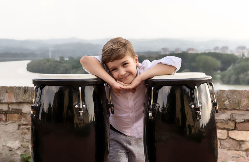 Portrait of smiling boy in car