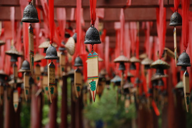 Close-up of wind chimes hanging outdoors