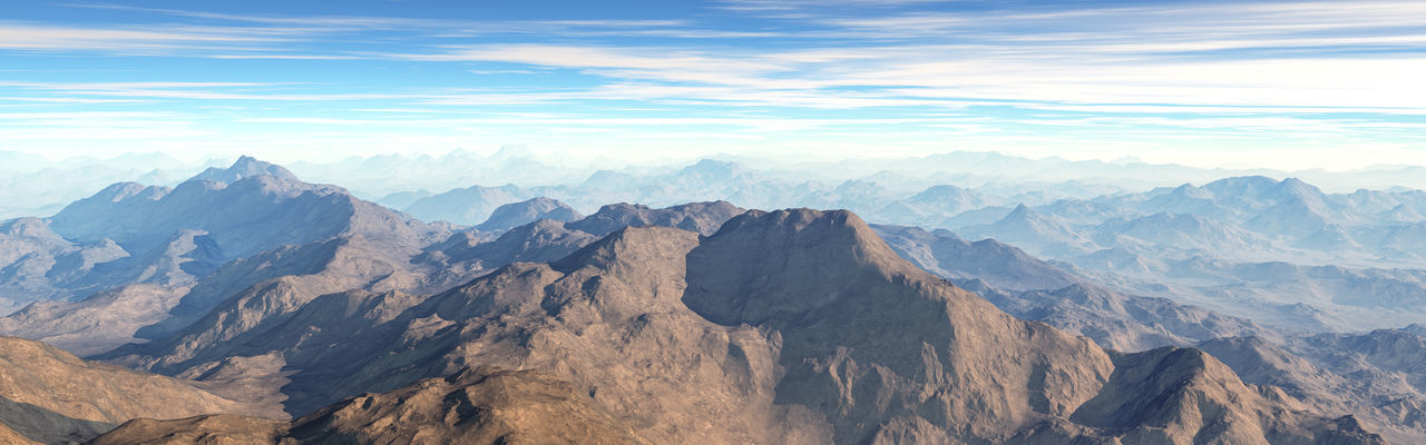 Panoramic view of rocky mountains against sky