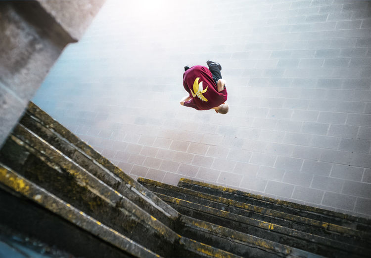 High angle view of woman on staircase