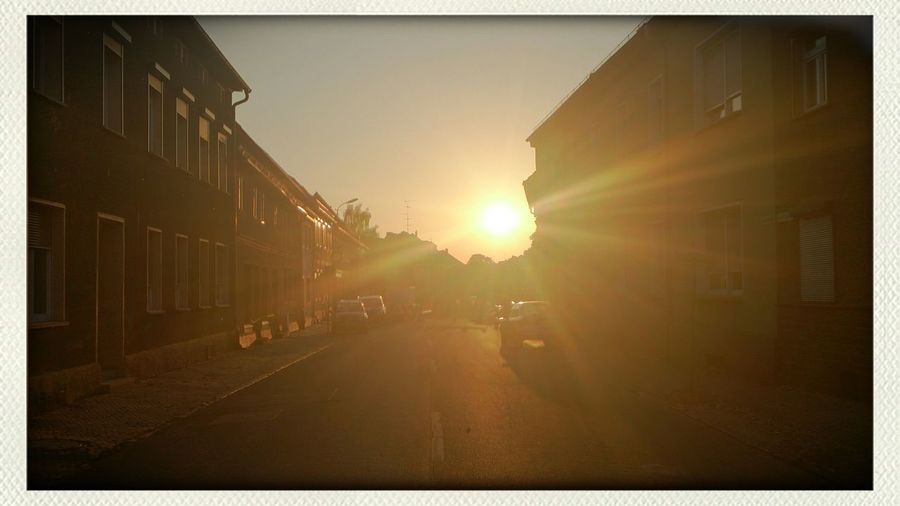 Sun shining through buildings