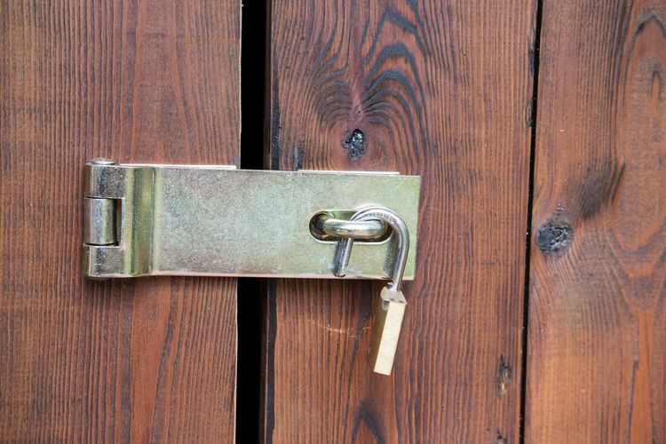Close-up of padlock on door
