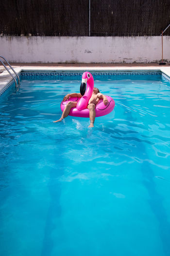 High angle view of women swimming in pool