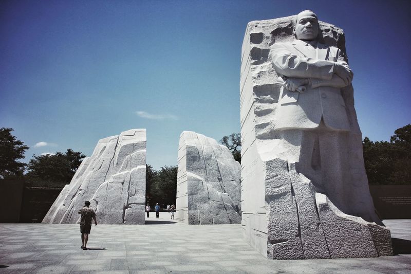 Low angle view of martin luther king jr statue against sky
