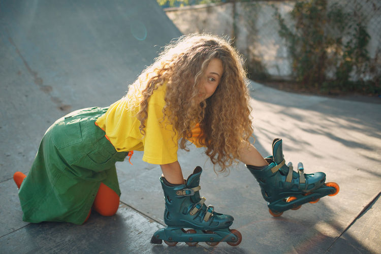 Smiling woman skating on ramp