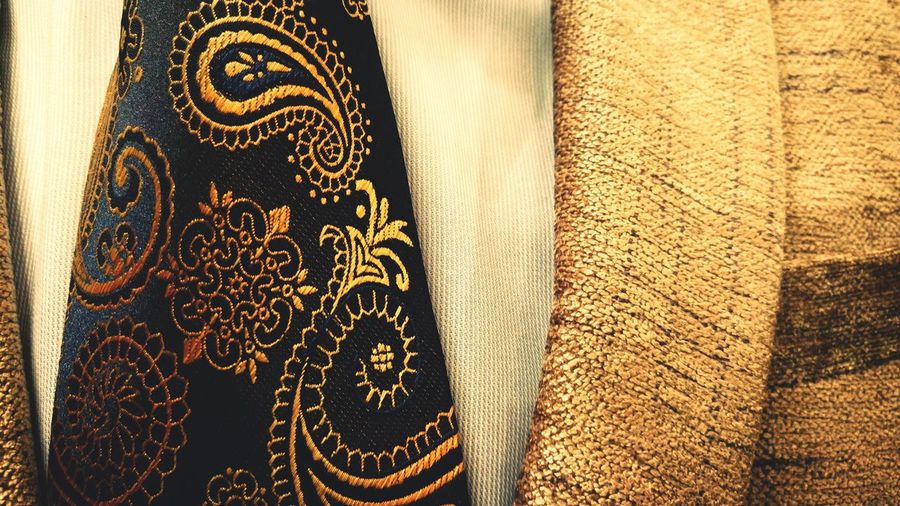 Close-up of floral pattern tie and suit