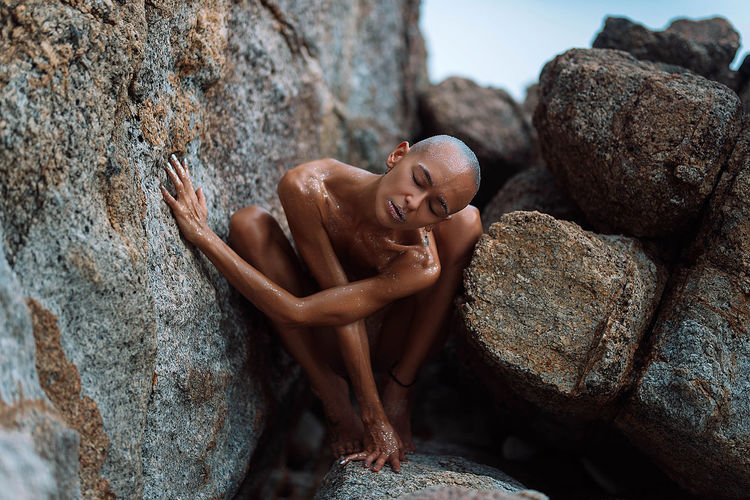 Young bald girl on the beach