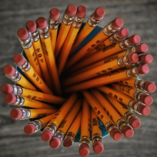 Directly above shot of pencils in container on table