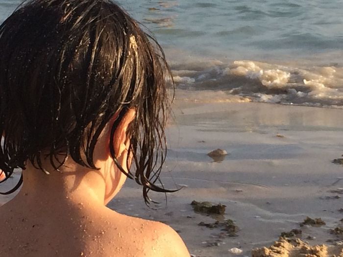 Rear view of woman on beach