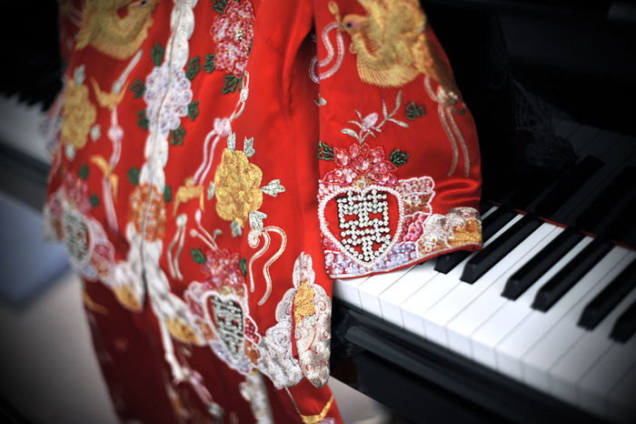 High angle view of chinese traditional dress on piano