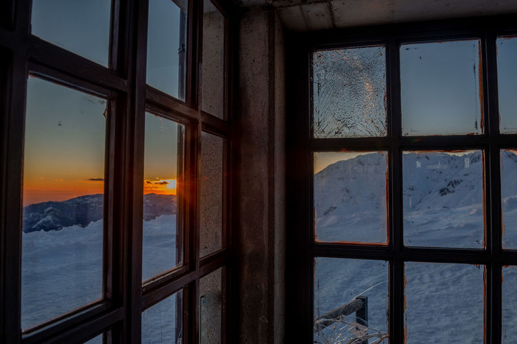 Sea seen through glass window during winter