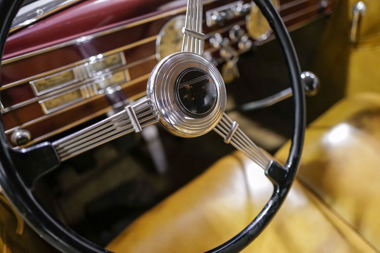 Vintage racing automobile steering wheel and dashboard