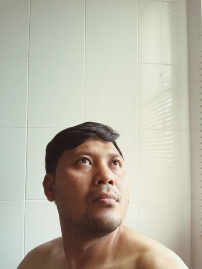 Close-up of mid adult man in bathroom