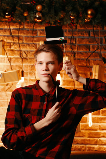 Portrait of mature man using mobile phone