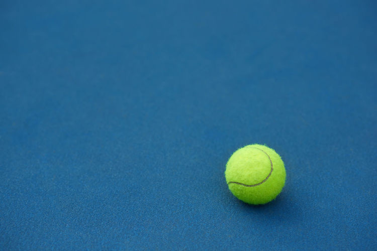 High angle view of green ball on blue background