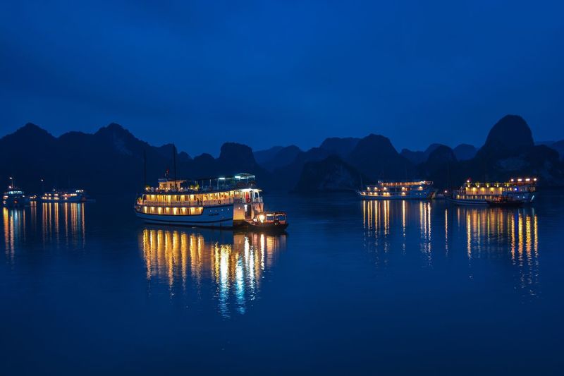 Scenic view of sea against clear sky at night
