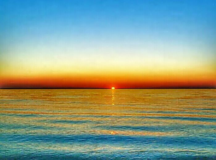 Scenic view of sea at sunset