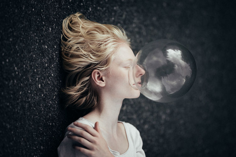 Adult Blond Hair Bubble Wand Childhood Close-up Day Fragility Headshot Holding Indoors One Person One Young Woman Only People Real People Young Adult Young Women Fresh on Market 2017 Rethink Things Perspectives On People The Portraitist - 2018 EyeEm Awards Capture Tomorrow