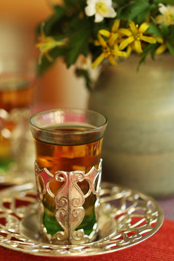 Close-up of tea in glass on plate