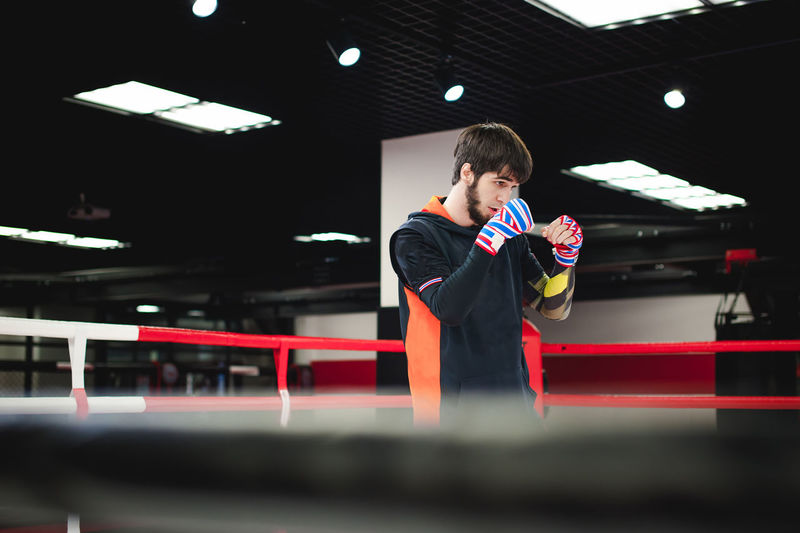 Man practicing in boxing ring