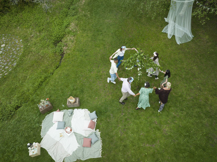 High angle view of people on grassy field