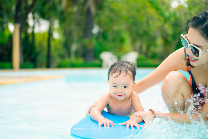 Portrait of happy girl in swimming pool