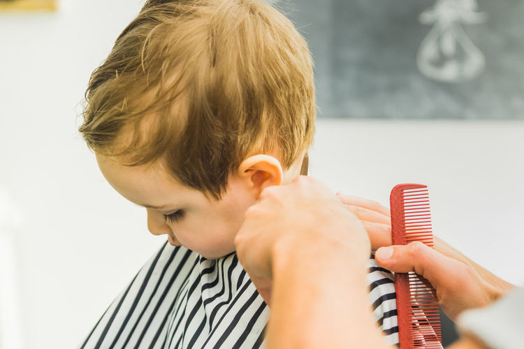 Boy getting haircut