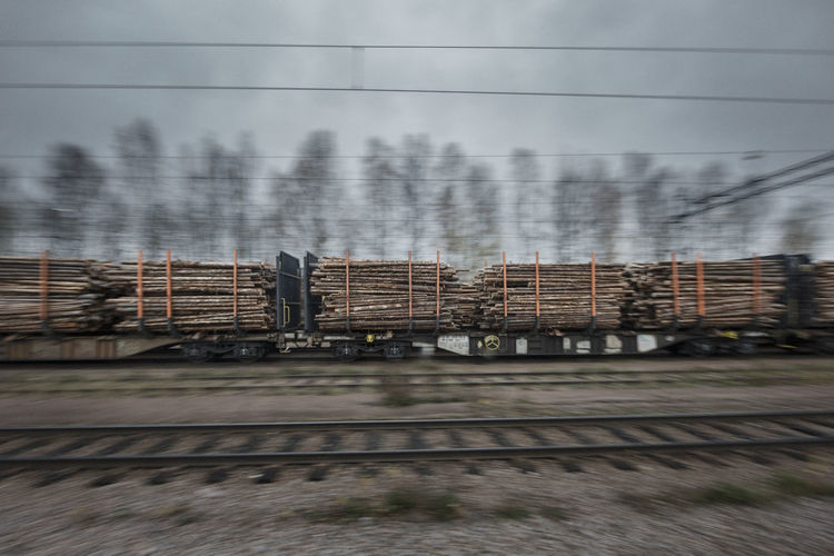 Train transporting timber, departing from mora in dalarna, north of sweden.