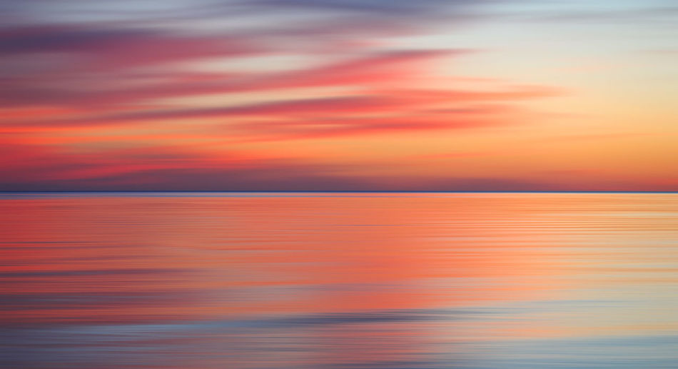 Scenic view of sea against romantic sky at sunset at chatham, cape cod. 