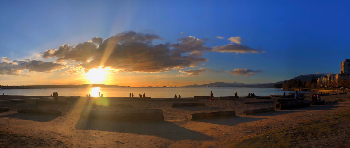 Panoramic view of beach against sky during sunset
