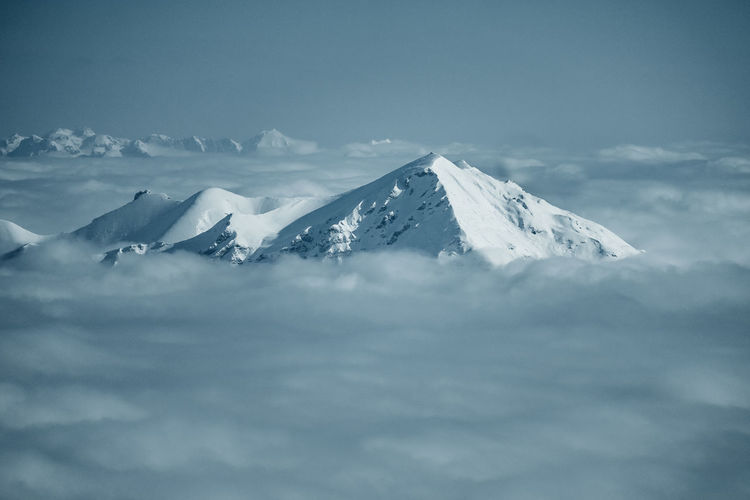 Scenic view of snowcapped mountains against sky