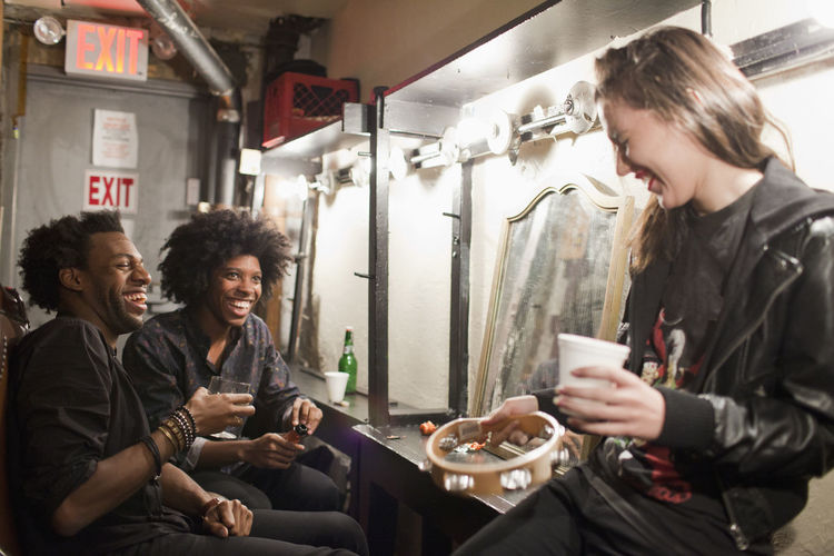 Young people hanging out backstage in a theater