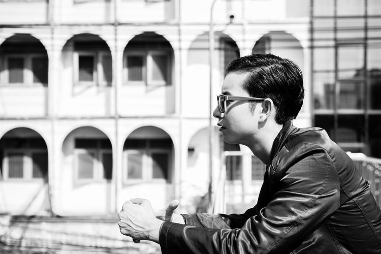 Side view of young man looking away