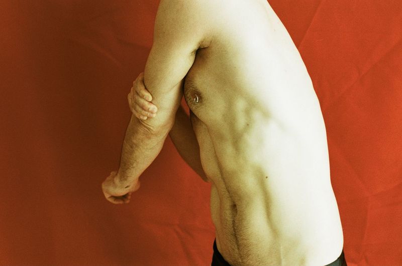 Low section of man wearing shoes