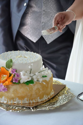 Midsection of ice wedding cake