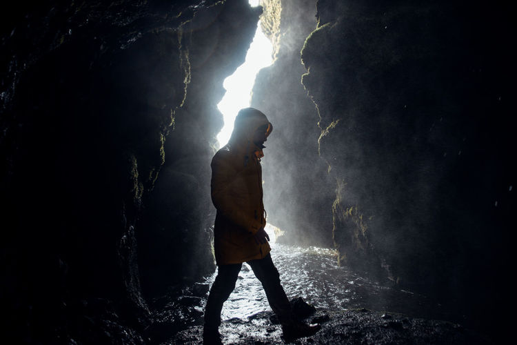 Full length of man walking in cave