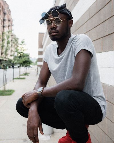 Sunglasses Sitting One Person Day Young Adult Real People Young Men Lifestyles Outdoors Eyeglasses Building Exterior Baseball Cap Architecture Adult People Adults Only EyeEm Selects