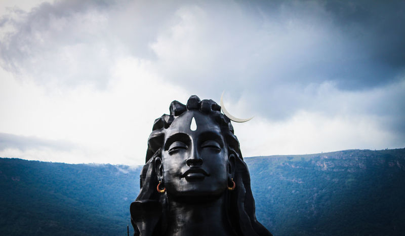Low angle view of shiva statue against sky | ID: 128362321