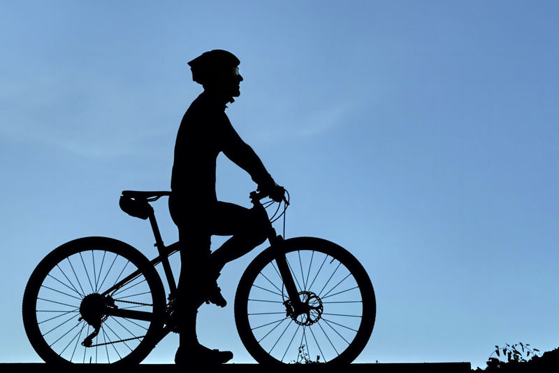 A silhouette of a cyclist