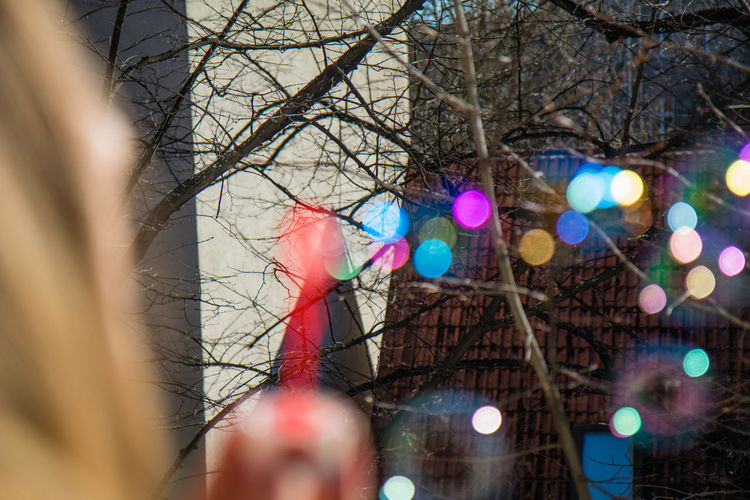 Close-up of hand holding illuminated christmas tree